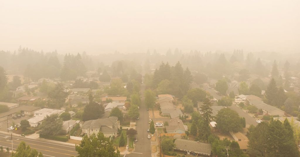 view of a city through hazy smoke